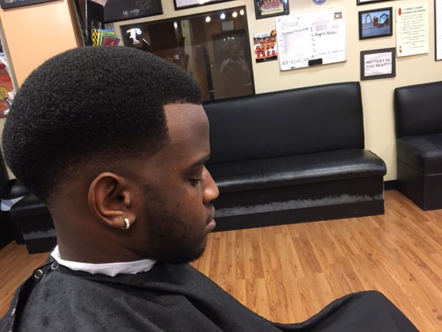 Tapered afro side profile shaped at the shop