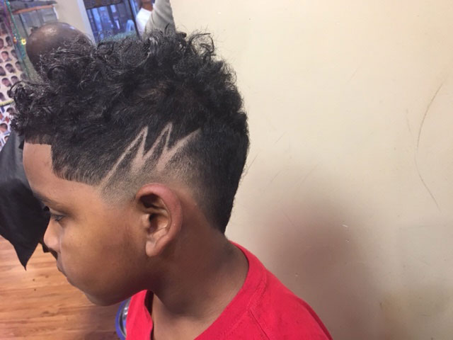 Kid's haircut with custom zig-zag hair design